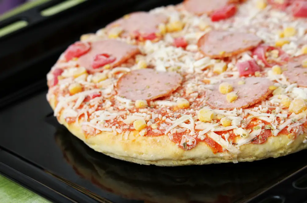 Frozen pizza with salami